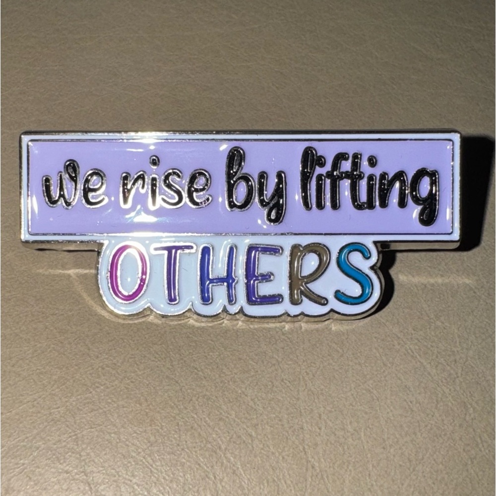 ★ FREE - “We Rise By Lifting Others” Enamel Pin